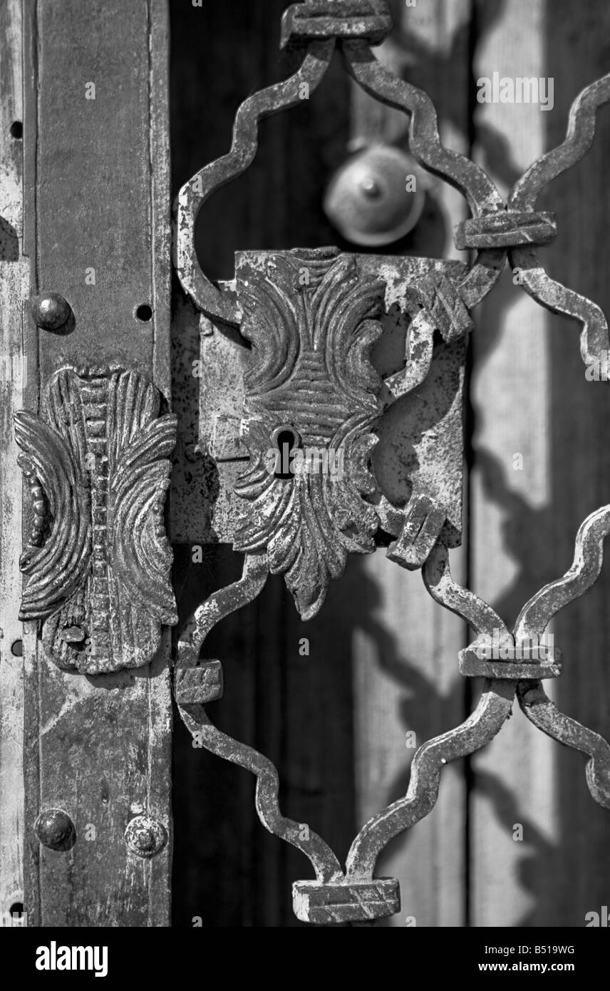Rusty old lock on an iron door - the photo is black and white Stock ...