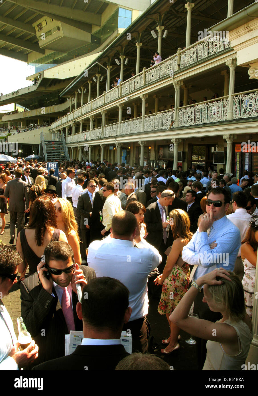 Women and men mingle at Randwick Racecourse Sydney Australia Stock Photo
