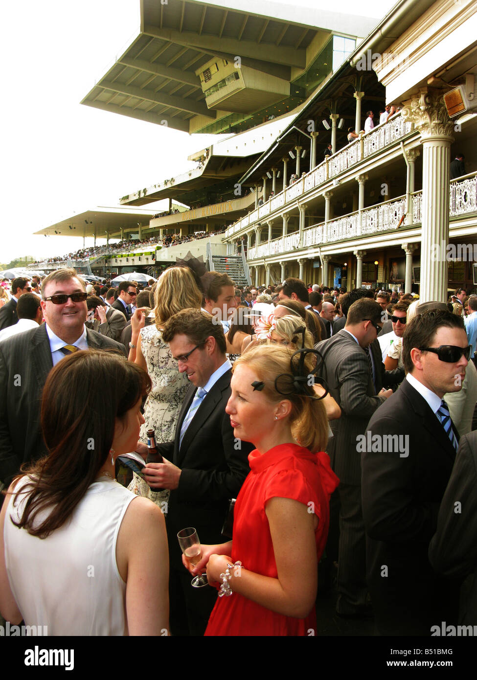 Women and men mingle at Randwick Racecourse Sydney Australia Stock Photo