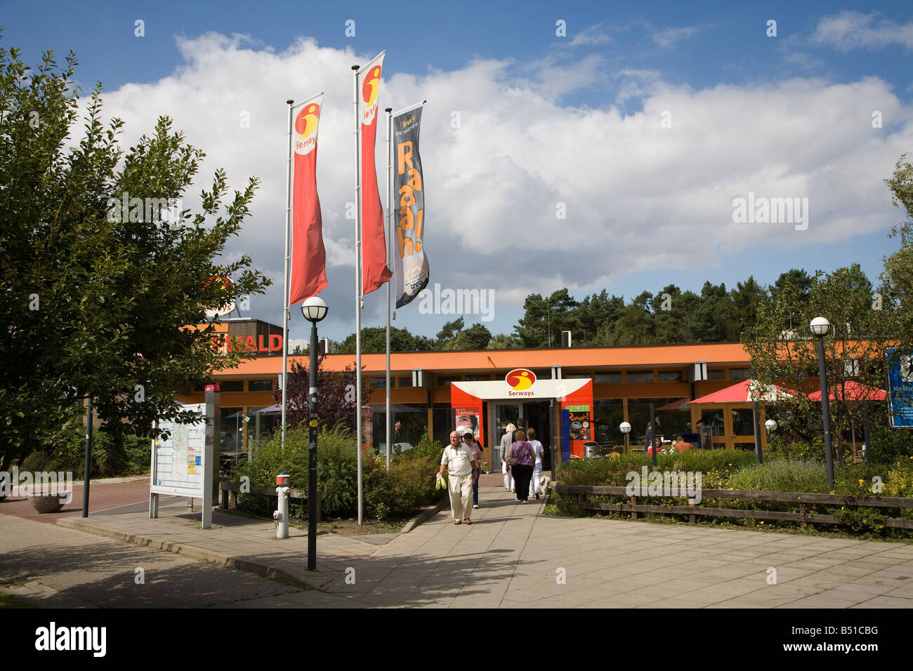 People in entrance to motorway autobahn service station Germany Stock Photo