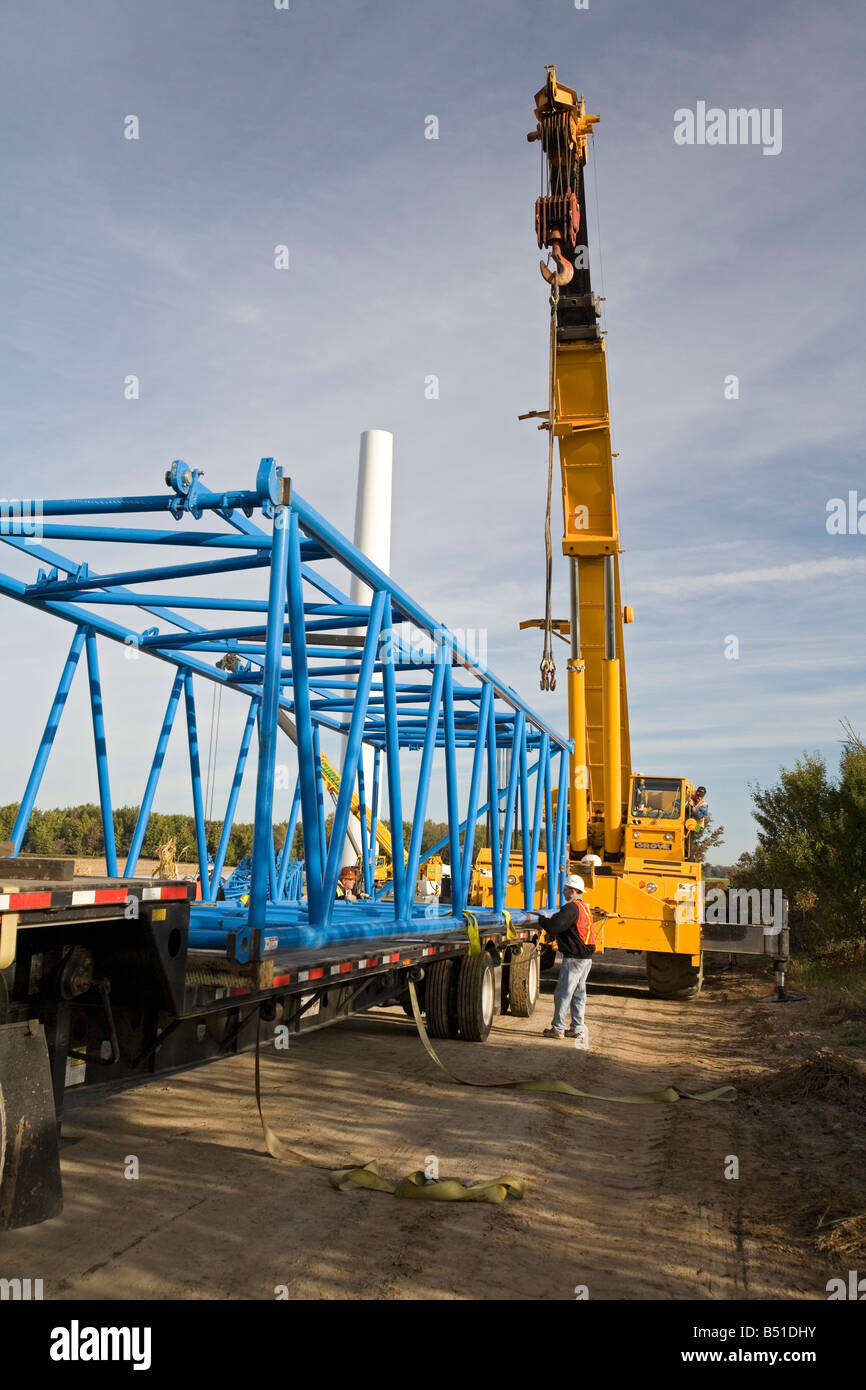 Workers Assemble Crane Used to Lift Blades Onto a Wind Turbine Stock
