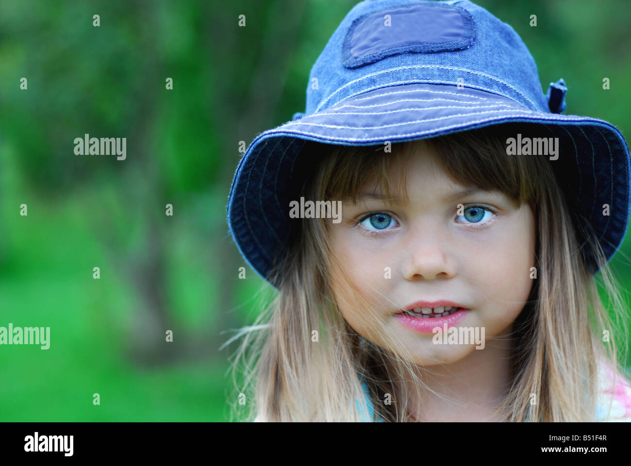 Beautiful little girl with cap on her head Stock Photo Alamy