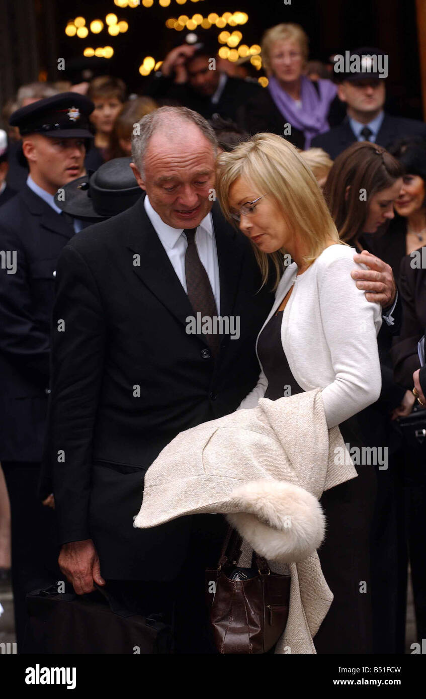 London Mayor Ken Livingstone comforts Michele the widow of Bill Faust after the memorial service for firefighters Bill Faust and Adam Meere at Westminster Cathedral Stock Photo