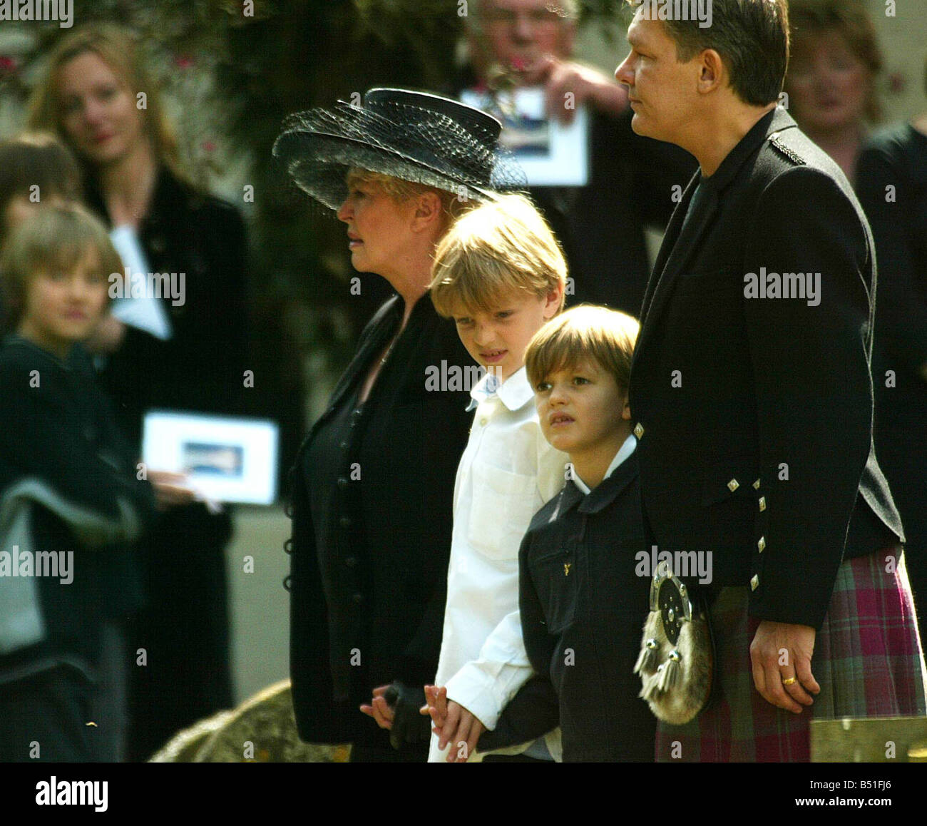 Caron Keating Funeral April 2004 St Peters Church in the grounds of Hever Castle in Kent Picture shows mother Gloria Hunniford children sons Charlie Lindsay Gabriel Lindsay husband Russ Lindsay Stock Photo