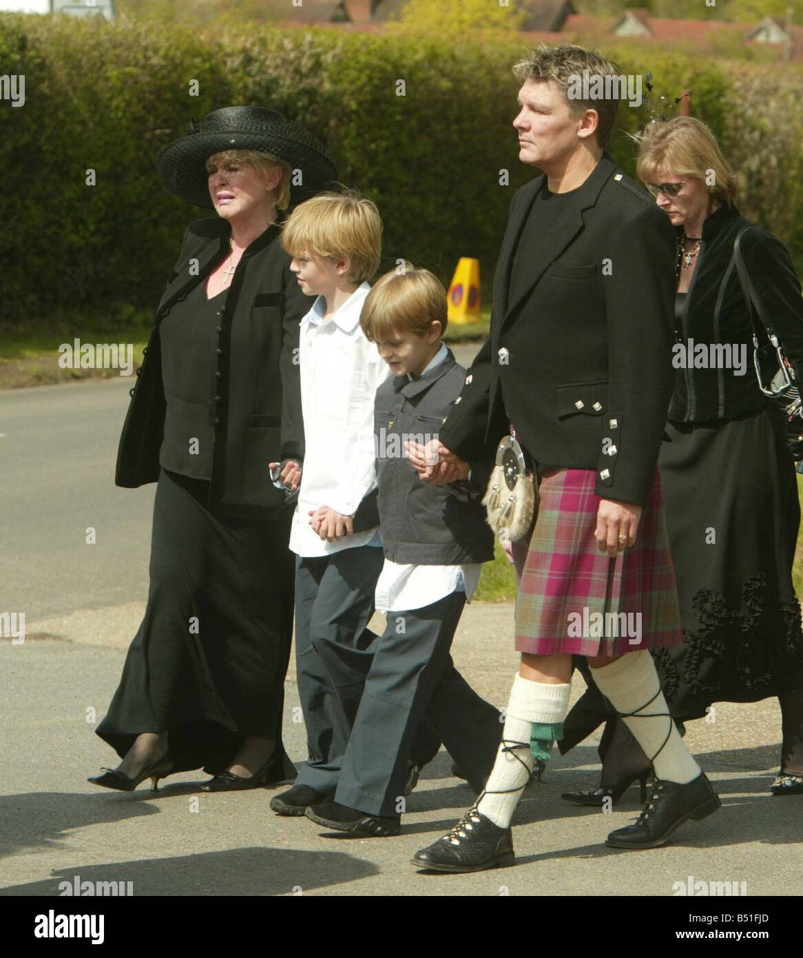 Caron Keating Funeral April 2004 St Peters Church in the grounds of Hever Castle in Kent Picture shows mother Gloria Hunniford children sons Charlie Lindsay Gabriel Lindsay husband Russ Lindsay Stock Photo