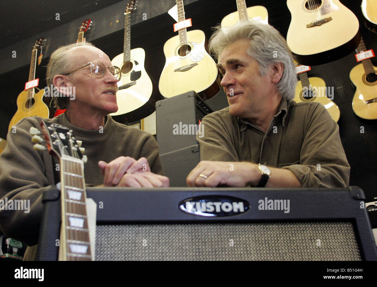 Lindisfarne band member Ray Jackson right presents a painting called