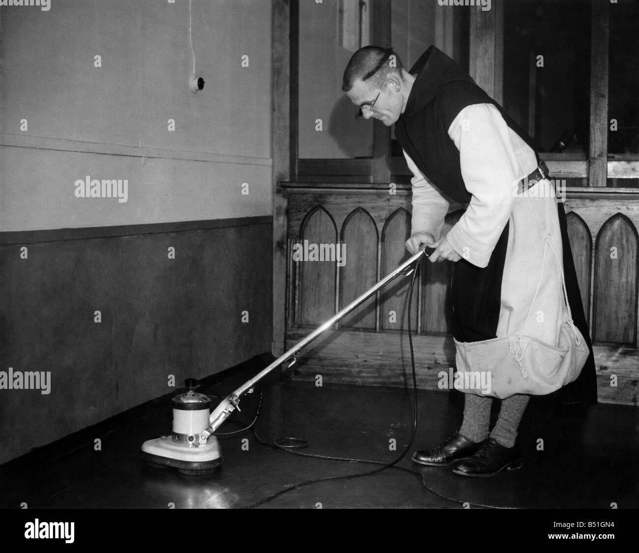 Monk cleaning the monastary floor. February 1948 P000186&#13;&#10; Stock Photo