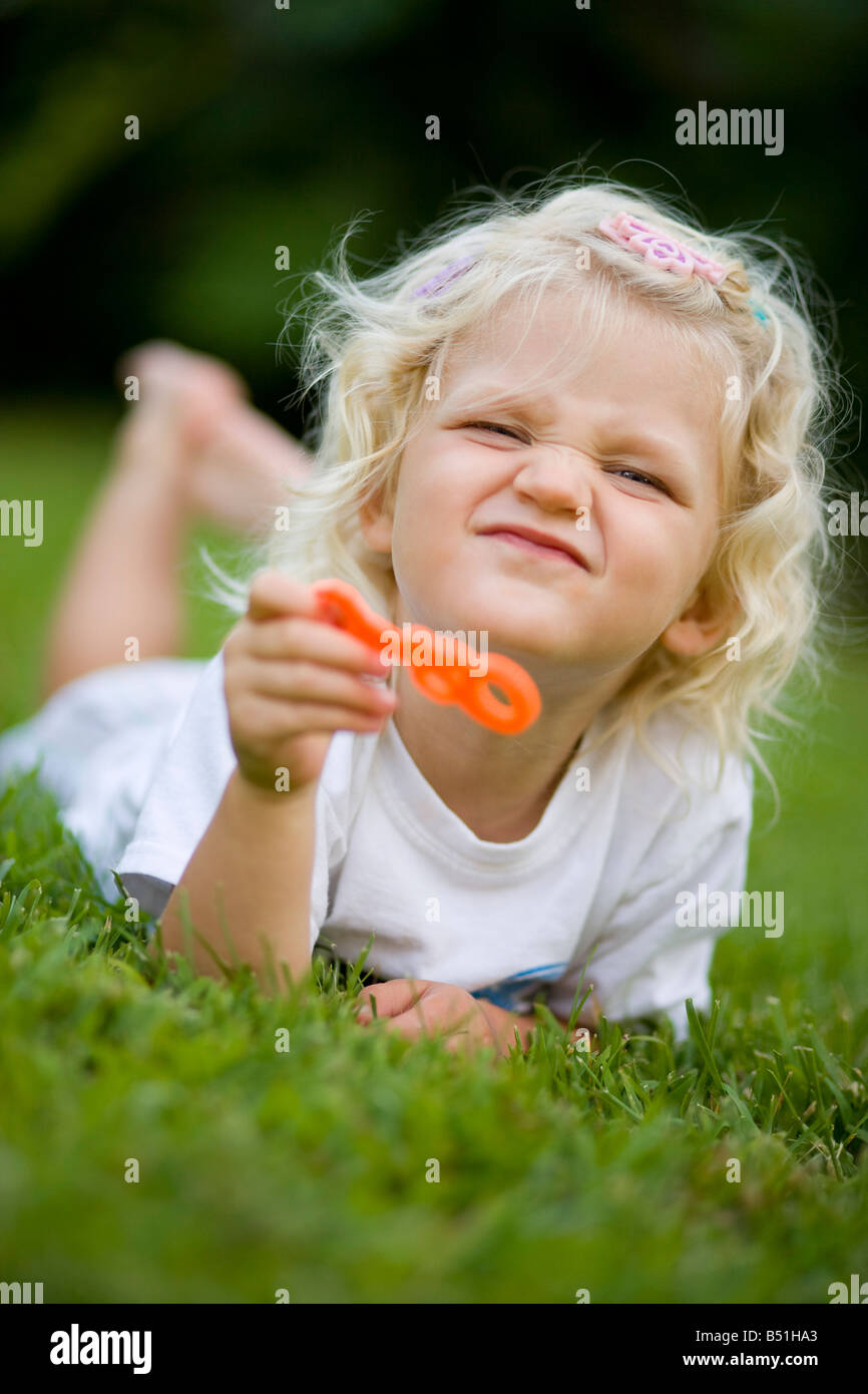 Girl Blowing Bubbles Stock Photo