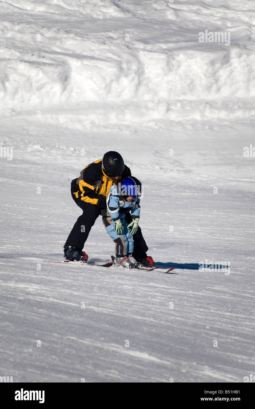 small child with the adult skiing Stock Photo