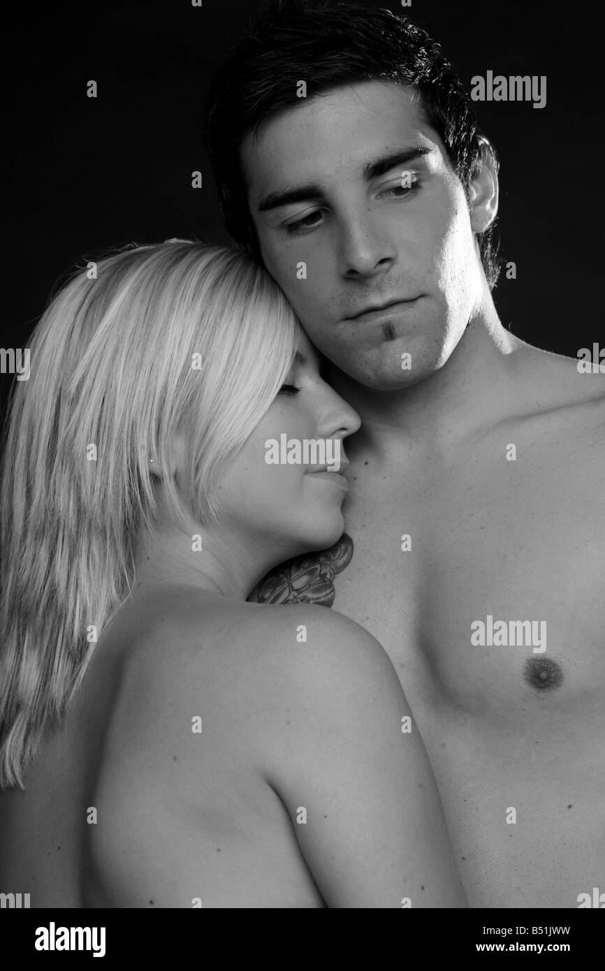 young man hugging a young woman Stock Photo