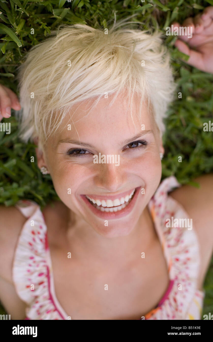 Portrait of Woman Lying on Grass Stock Photo Alamy