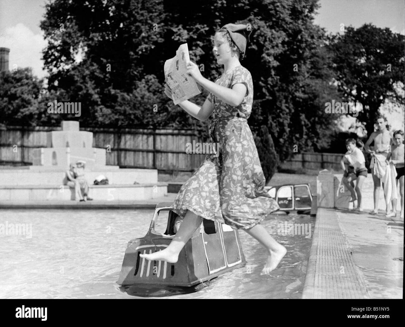 Road safety lessons at Hemel Hempstead swimming pool organised by Mr A L Whittle. Traffic accidents are re-enacted in the pool with traffic lanes marked out.;Barbara Whitehead 13;Staff Photographer F W Reed;DM 21/8/51;B3986 Stock Photo