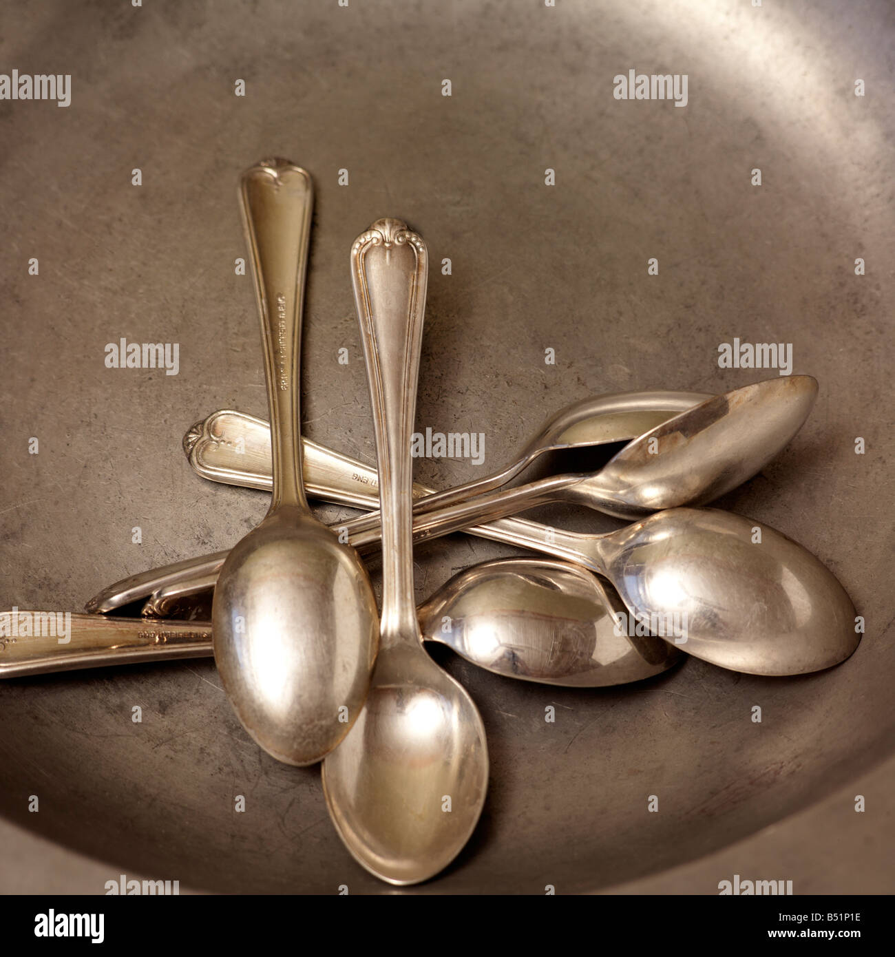 Silver Spoons on Round Silver Plate Stock Photo Alamy