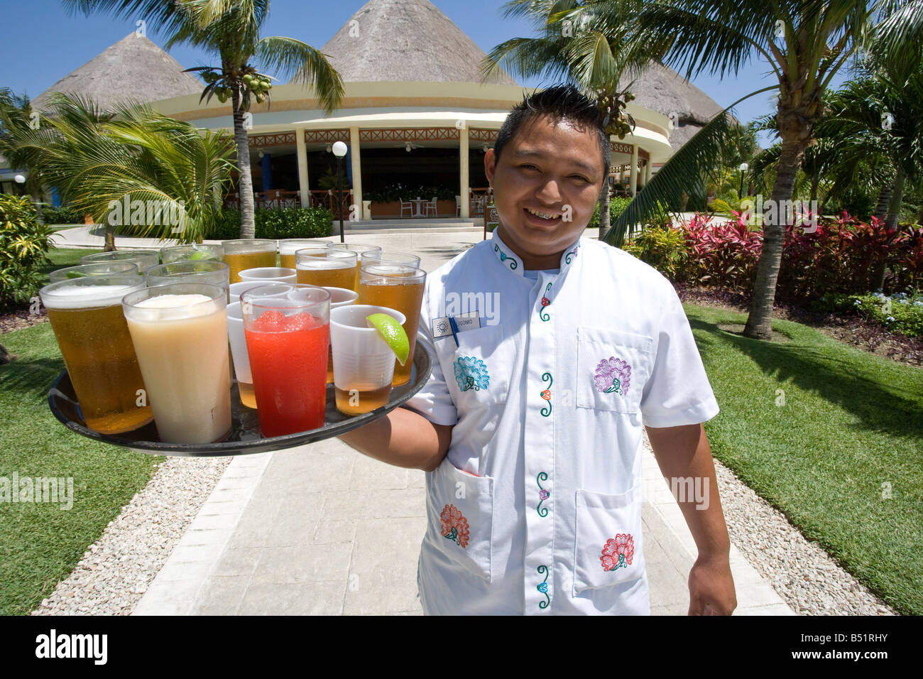 Portrait of Waiter with Tray of Drinks, Mexico Stock Photo