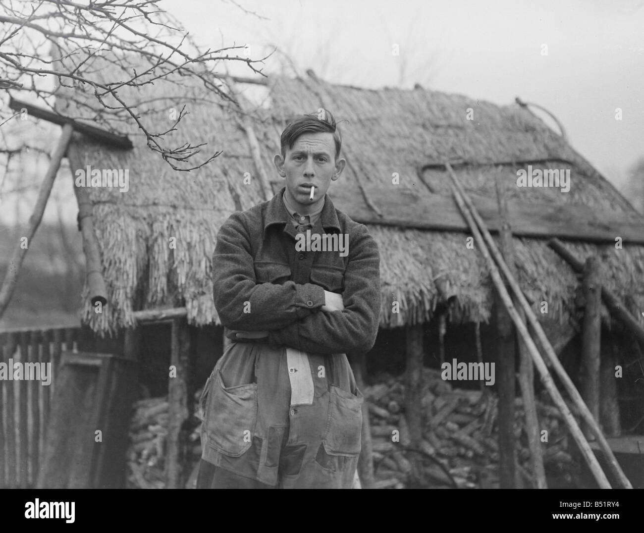 Antoon van den Hurk Mathematician Standing in front of thatched property with cigarette in 'mouth,' arms crossed. SP 02/03/1952 Stock Photo