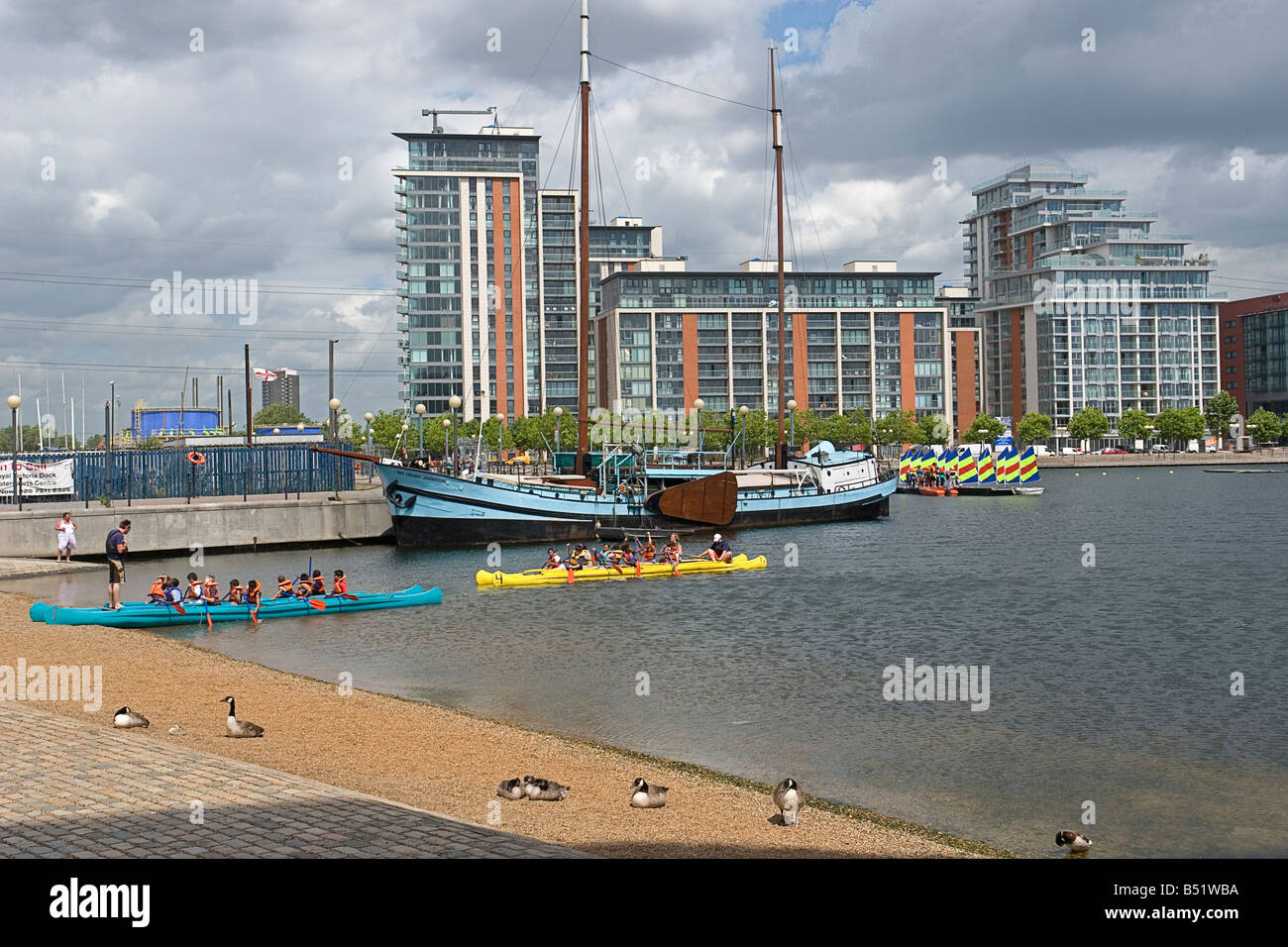 Children learning the basics of canoeing at Royal Victoria Dock Watersports Centre in east London UK Stock Photo