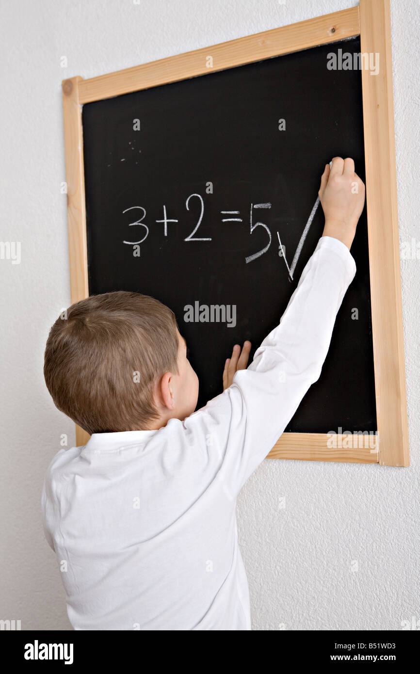 Child when learning arithmetic reading writing Stock Photo - Alamy