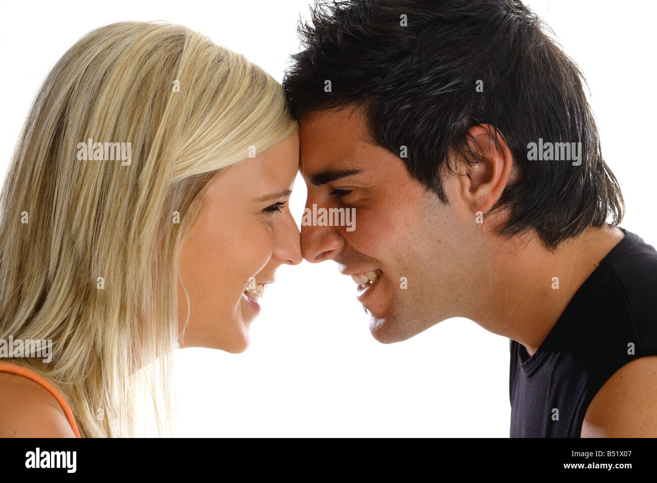 Young couple puts their heads together Stock Photo - Alamy