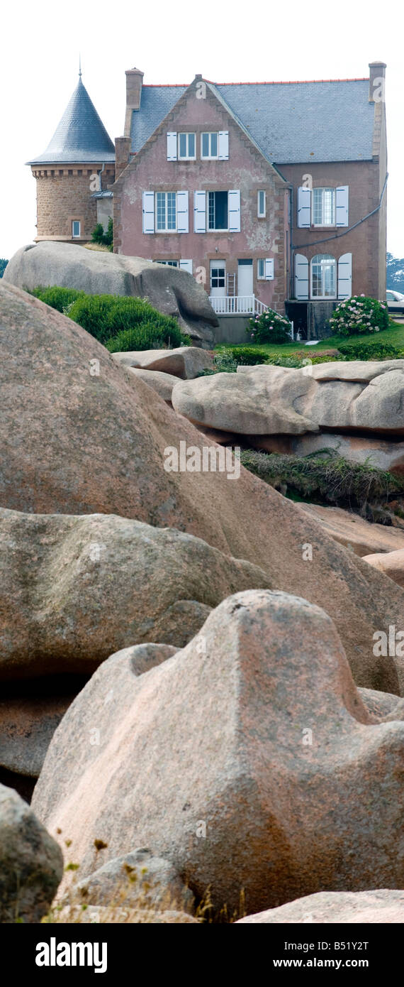 House between the rocks of the Cotes d'Armor in Finistere in Brittany in France Stock Photo