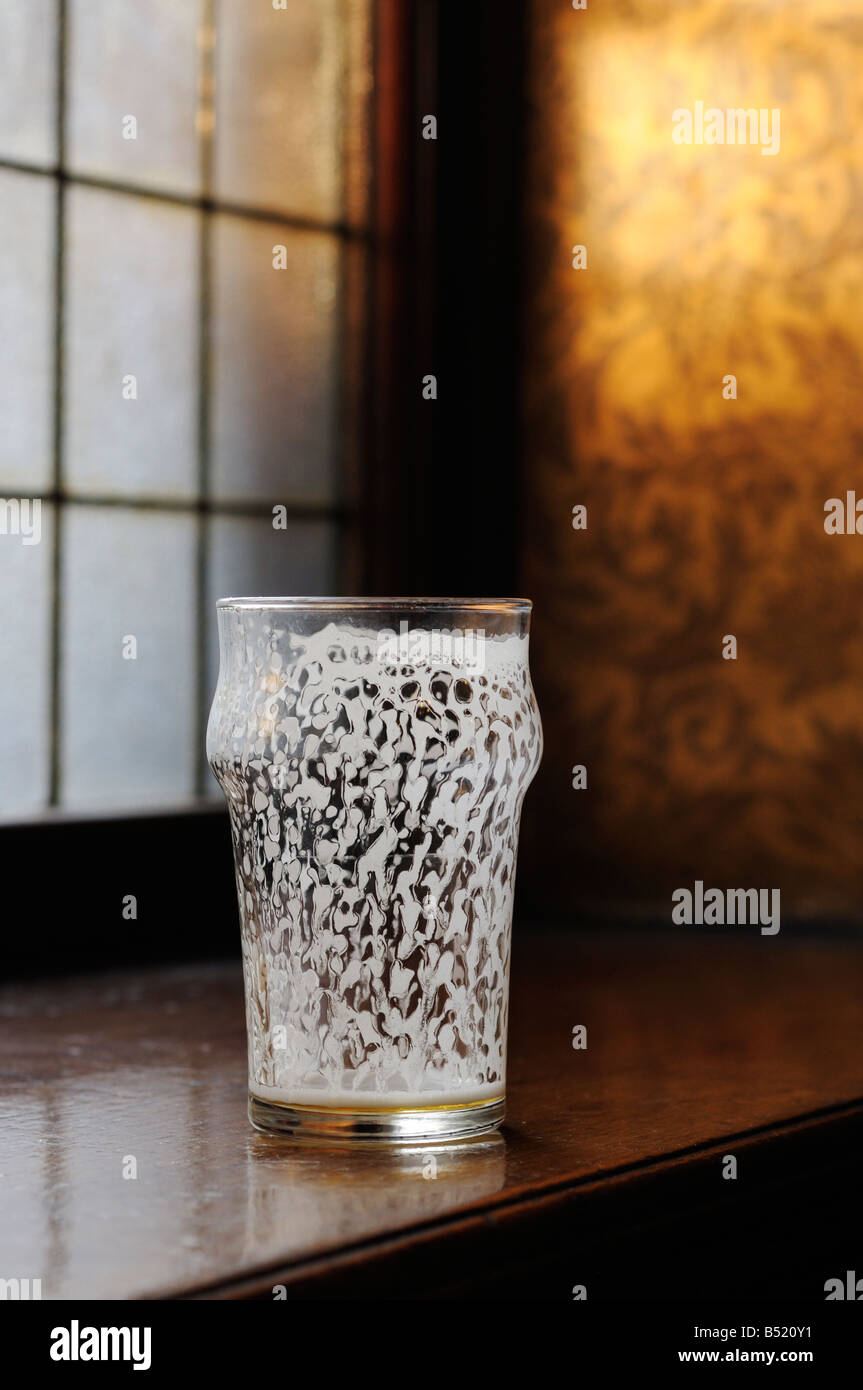 Empty half pint 'nonic' beer glass Stock Photo
