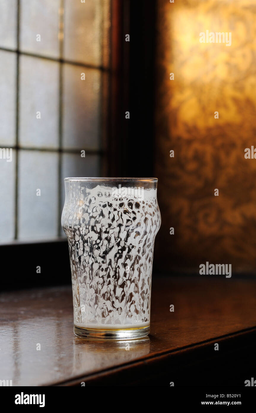 Empty half pint 'nonic' beer glass Stock Photo Alamy