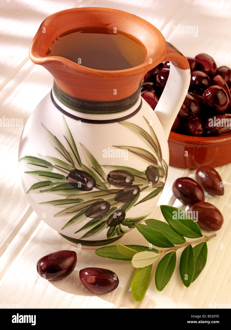JUG OF OLIVE OIL AND OLIVES Stock Photo Alamy