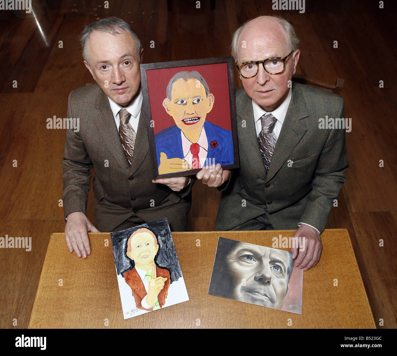 Pic James Vellacott Gilbert and George with the Winner middle by Harry Pye and runners up left 2nd by David Pingwall and right 3rd by Sarah Ewing of the Daily Mirror Tony Blair art competition Stock Photo