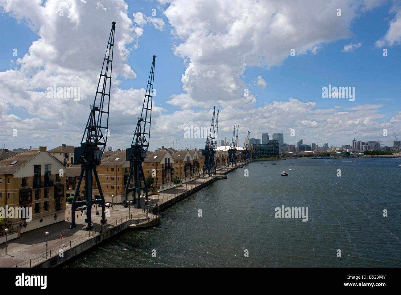 old cranes in front of the Britannia Village on the Royal Victoria Dock - Silvertown - East London - UK Stock Photo