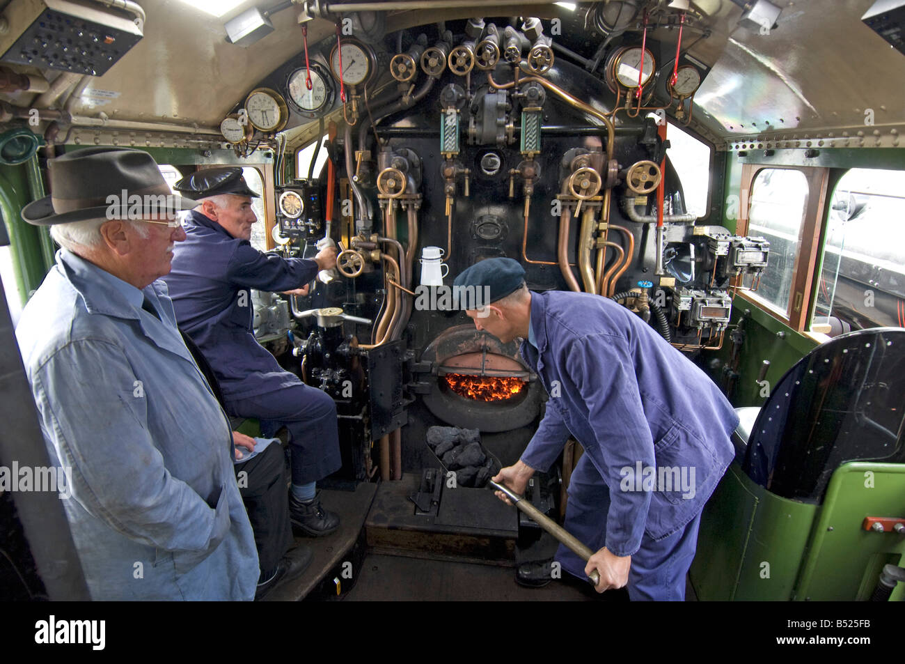 Inside the cab of an A1 Peppercorn class Pacific steam engine  The train is 60163 Tornado, on the Great Central Railway. Stock Photo