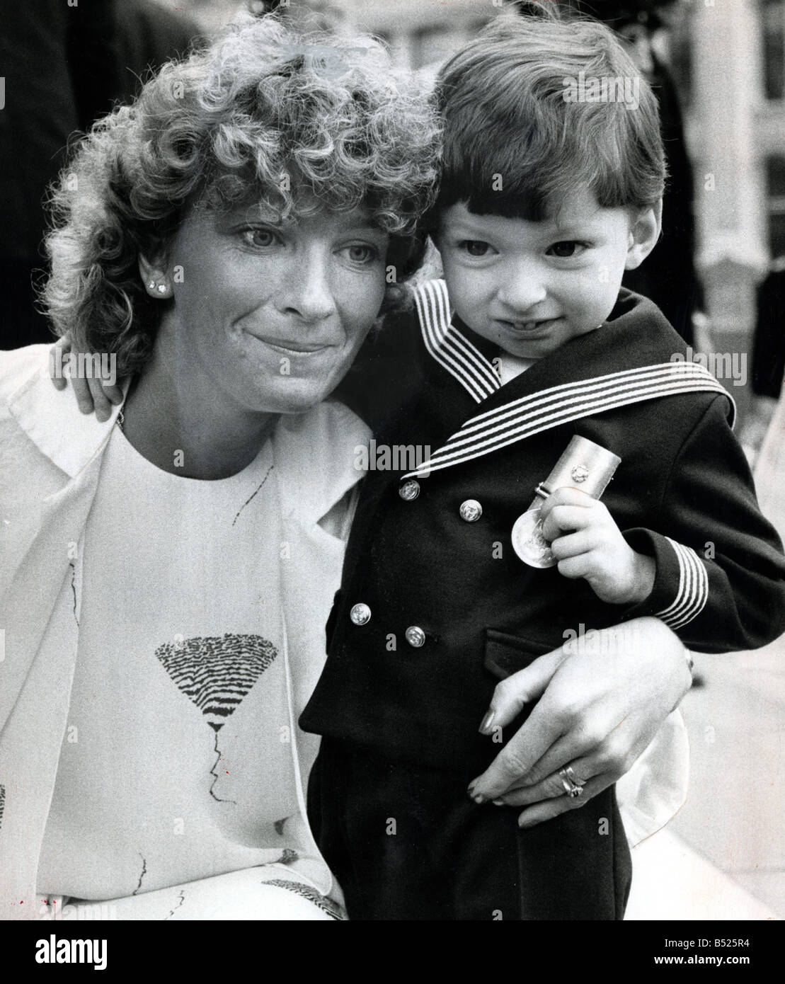 Falklands Memorial service at St.Pauls;Jean Stroud, whose husband was killed in the Falklands with her 31/2 year old son John Paul in a Naval Uniform and his Father's Falklands Campaign Medal.;4th June 1985 Stock Photo