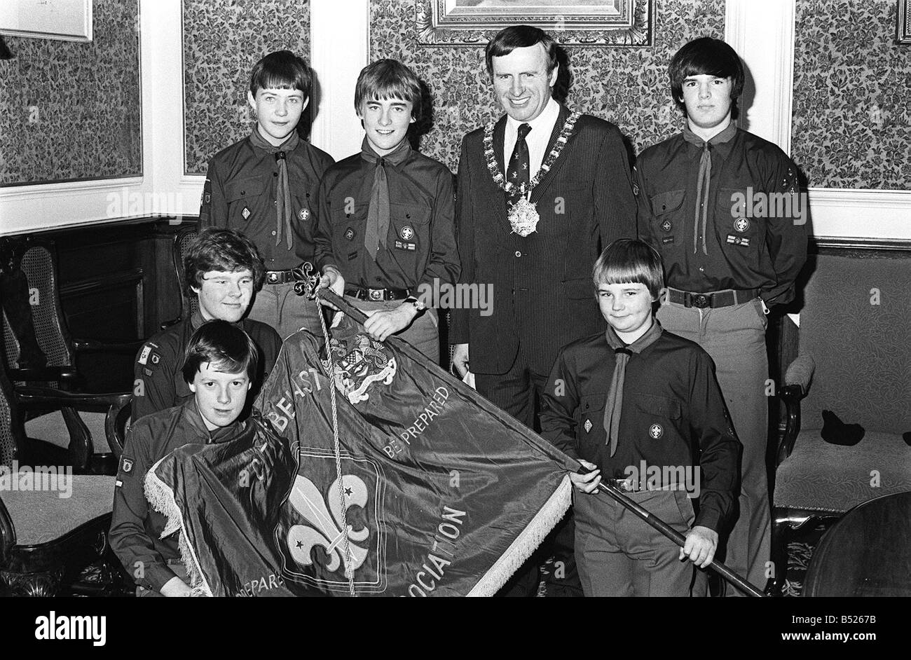 Presentation Of The County Scout Flag October 1980 The Lord Mayor Alderman John Carson presenting the county Scout flag to the winning troup Team leader Charles Montgomery Neil Thompson Neil Sinclair Alistair McCarley Mark Roberts and Neil McCullough from 10th East Belfast Scouts Newtownards The boys were awarded the flag when they won a camping and general scouting competition at Crawfordsburn Scout camp Stock Photo