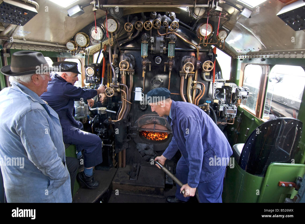 Inside the cab of an A1 Peppercorn class Pacific steam engine  The train is 60163 Tornado, on the Great Central Railway. Stock Photo