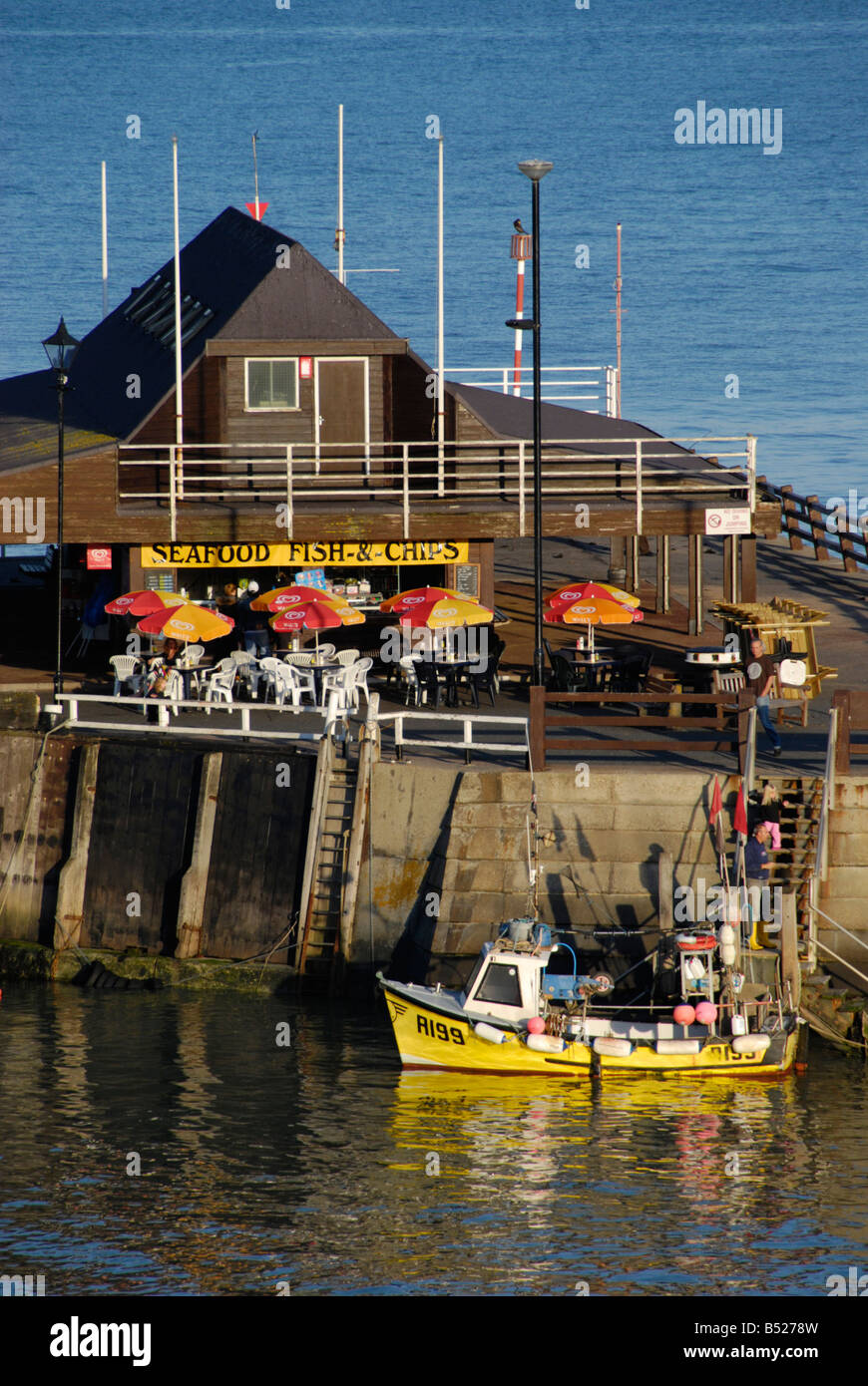 Seafood restaurant and fishing boats in Viking Harbour Broadstairs Kent England Stock Photo