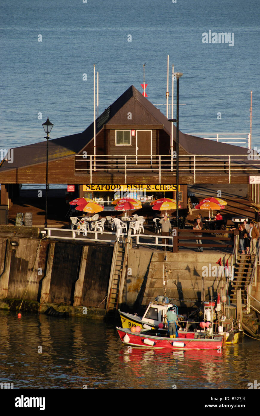 Seafood restaurant and fishing boats in Viking Harbour Broadstairs Kent England Stock Photo