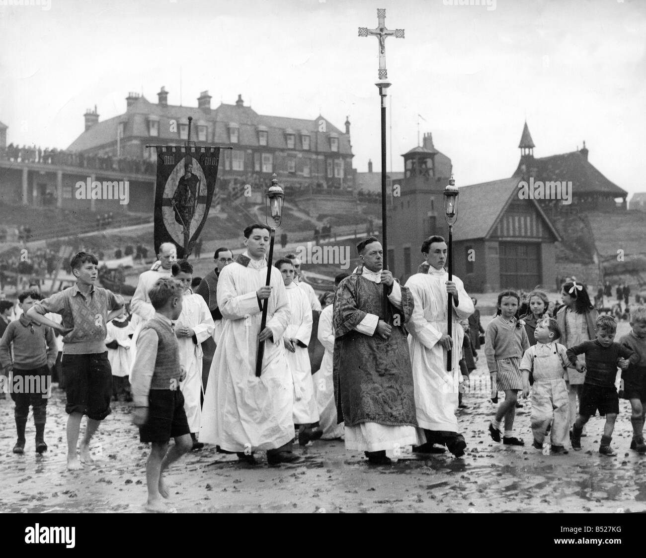 The clergy, the Crucifer, the torch bearers and the choir of St Georges
