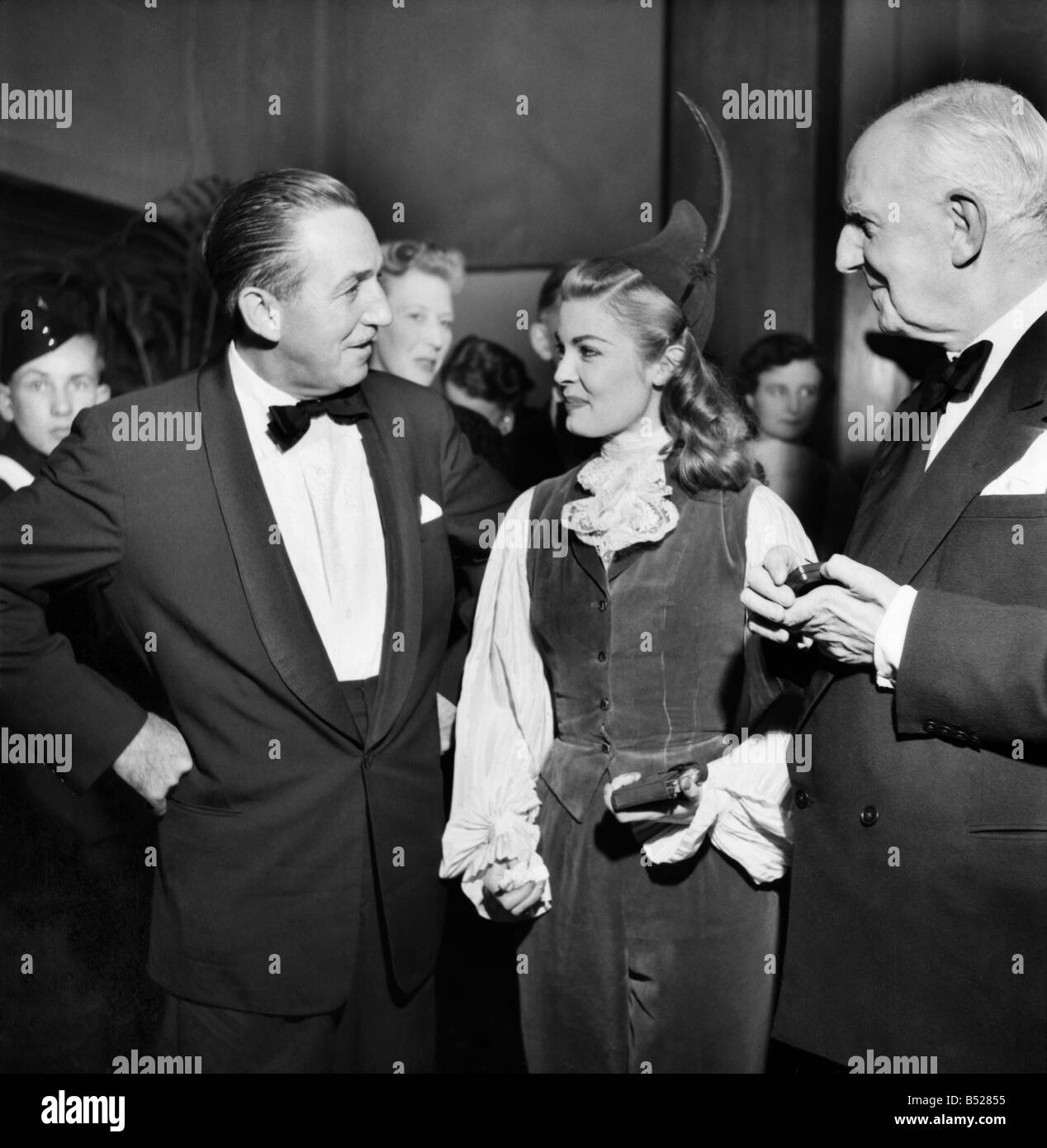 Candian Actress Patricia Owens meets Walt Disney and Lord Woolton. Patricia is in London to promote the new Disney film Peter Pa Stock Photo