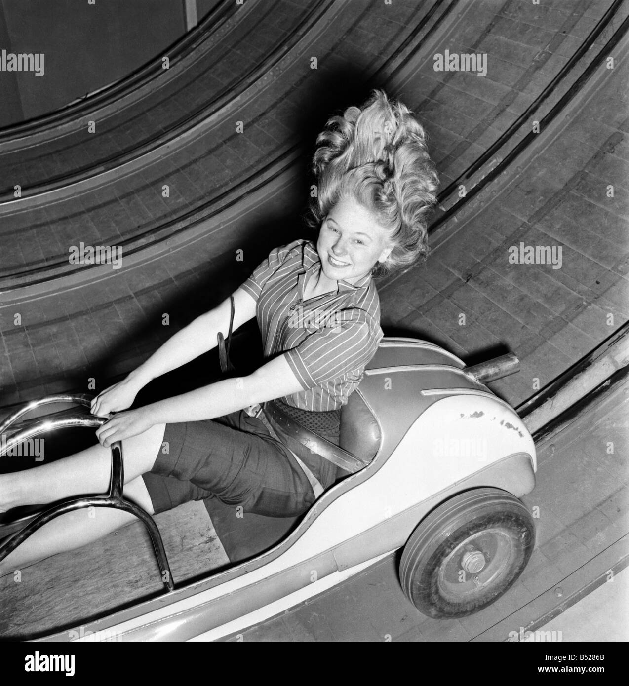 Fun fair - Jean Baker on one of the rides at the festival gardens Battersea. April 1953 D2100 Stock Photo