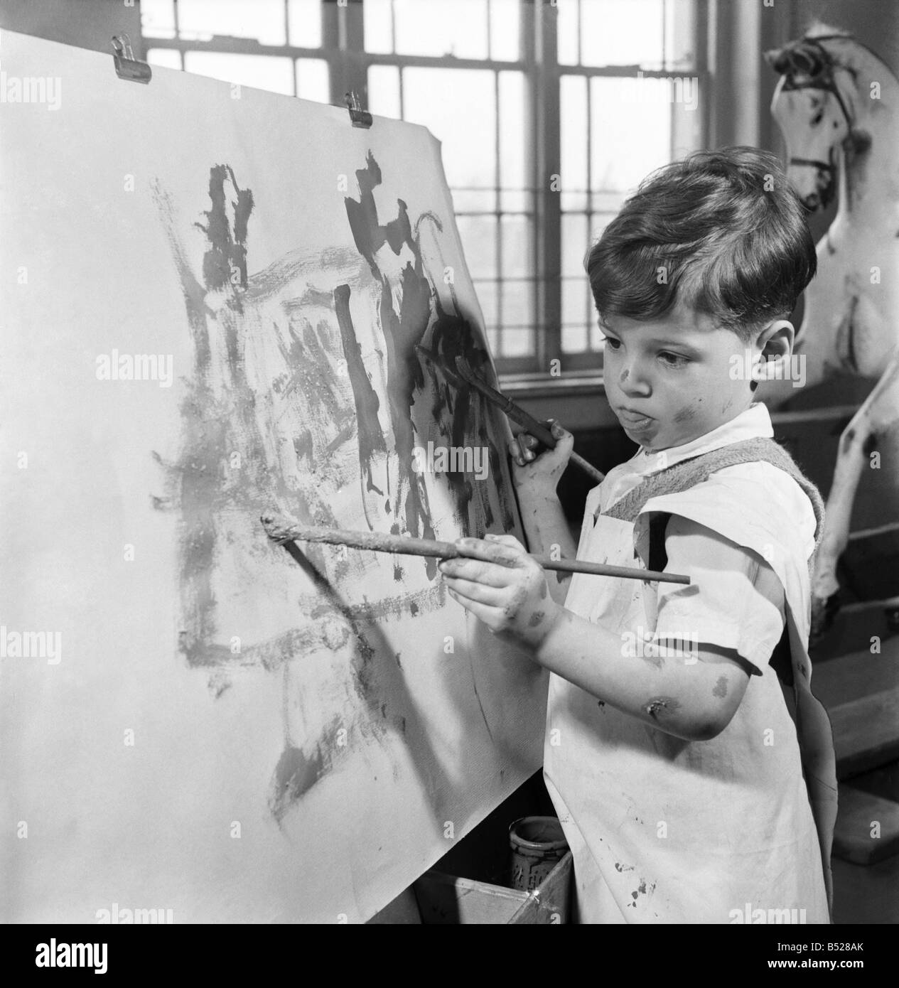 The four year old two handed artist is Louis Savva at work on his ...