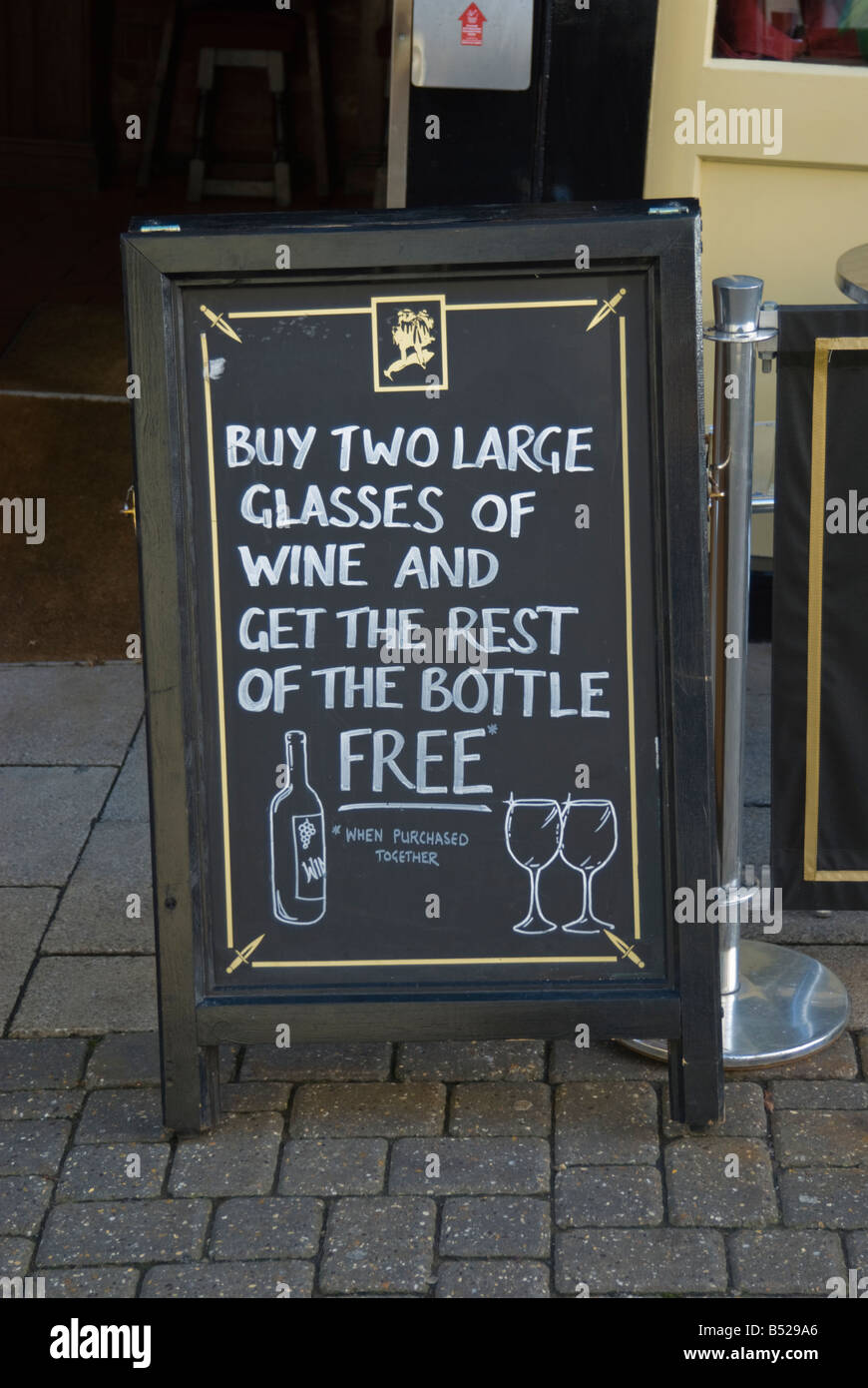 Sign outside uk pub advertising offer on wine Stock Photo