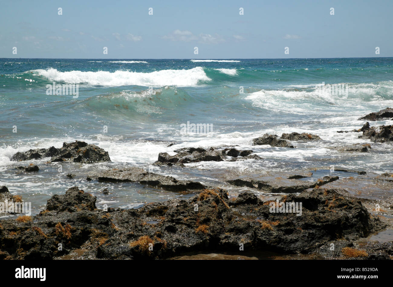 Beautiful and wild section of shore near Ariel Sands, Shore Road, Devonshire Parish, Bermuda showing  Boilers and Rim Reef Stock Photo