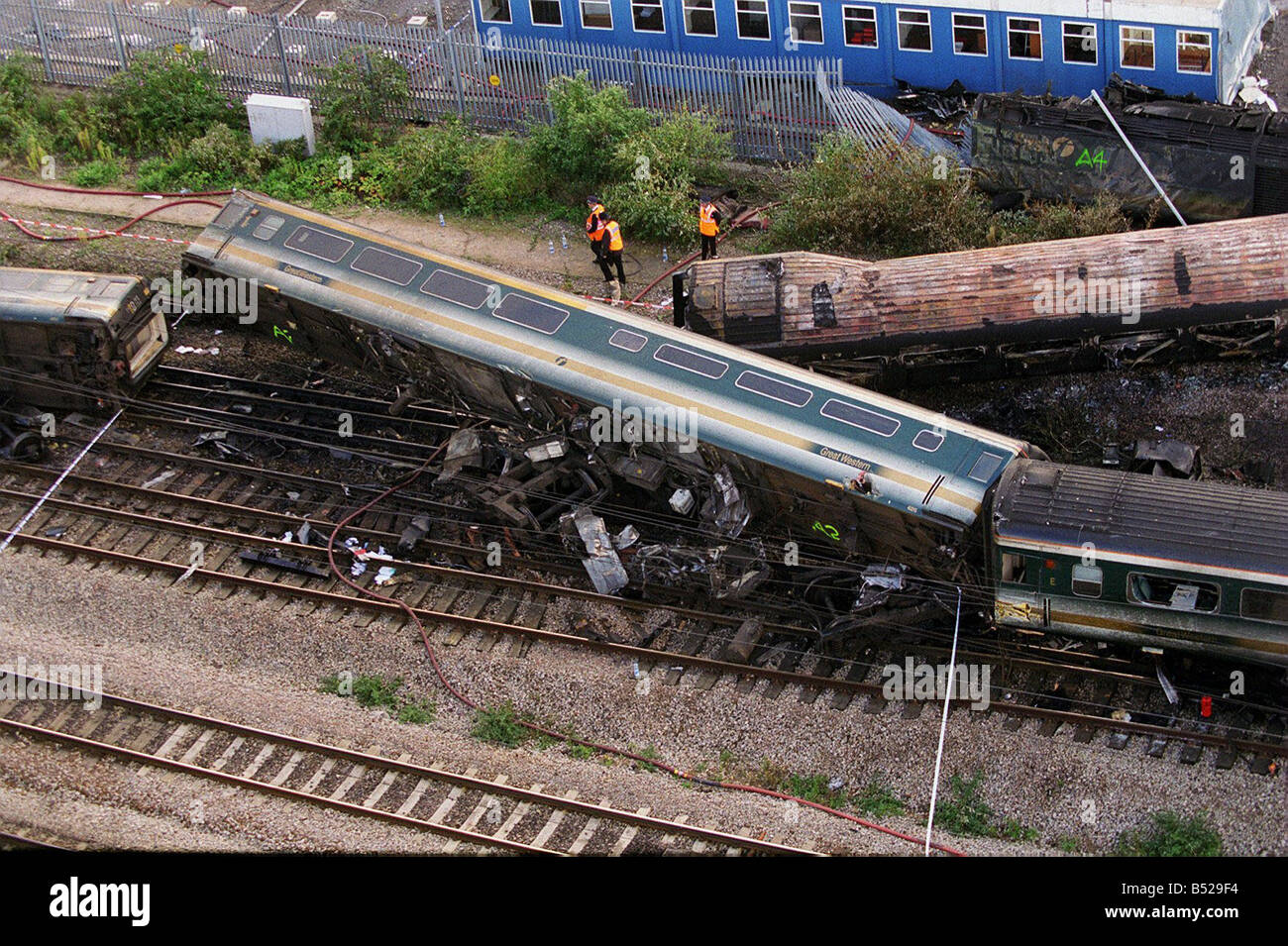 Overhead view of the Paddington Railway Accident Oct 1999 Derailed carriage of train involved in the crash on its side next to a burnt out wrecked carriage in Ladbroke Grove near Paddington Station Stock Photo