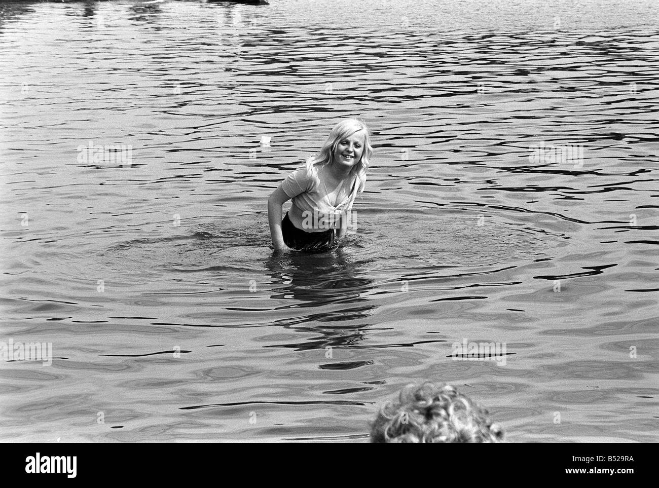 A concert goer cools of in the serpentine during the free Rolling Stones concert in Hyde Park London 05 07 1969 Stock Photo