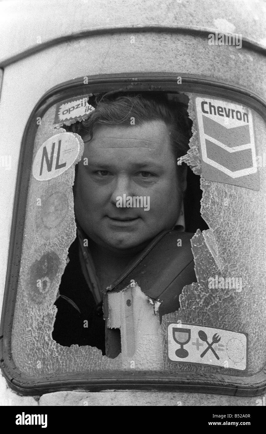 David Bellyou sits in the cab of his lorry after his windows were smashed by pickets Mr Bellyou was carrying 20 tons of medical Stock Photo