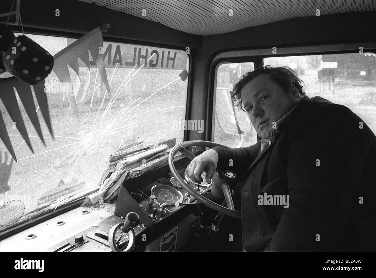 David Bellyou sits in the cab of his lorry after his windows were smashed by pickets Mr Bellyou was carrying 20 tons of medical Stock Photo