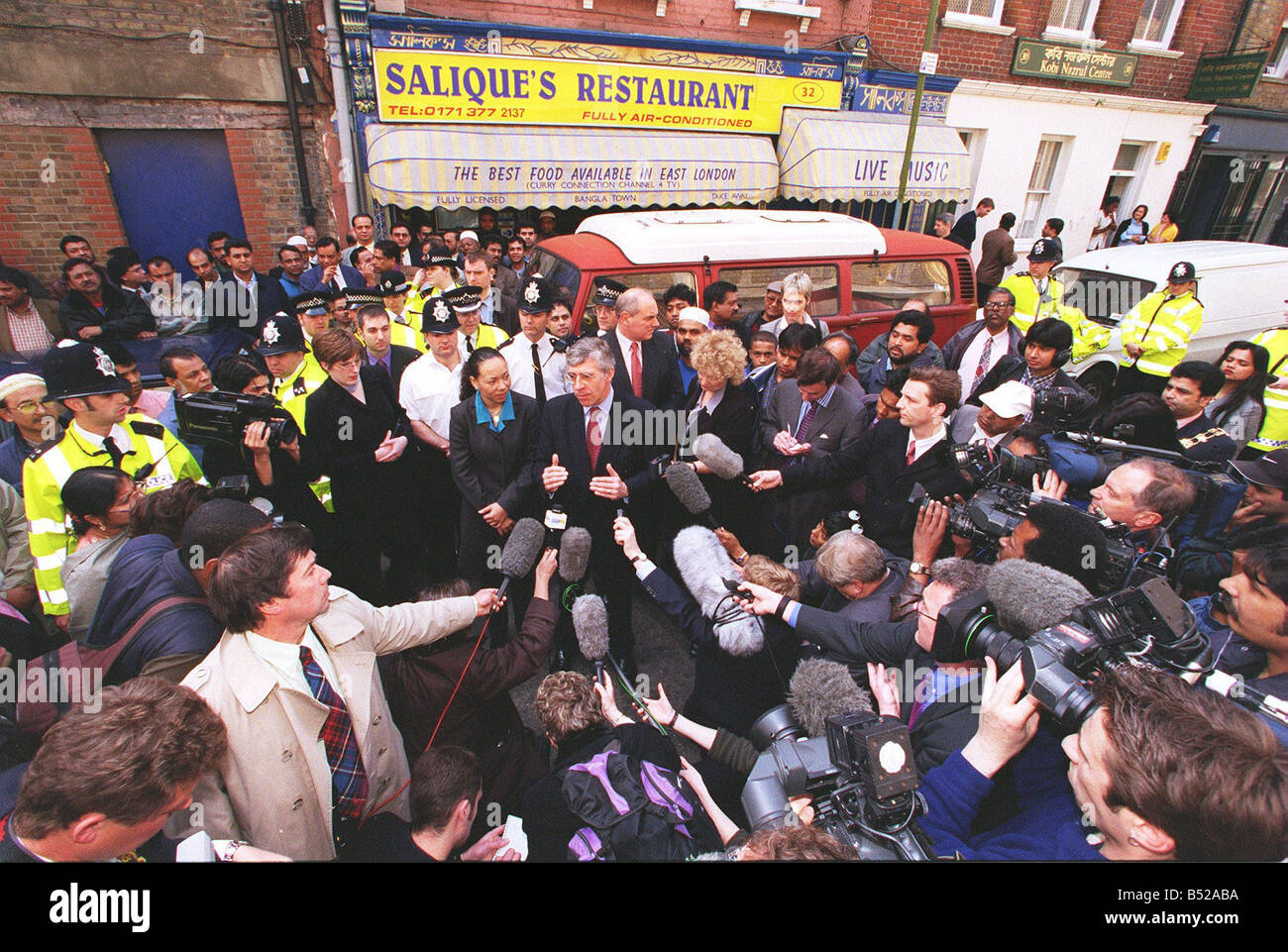 Jack Straw Home Secretary April 1999 surveys area of damage caused by Brick Lane Nail Bomb Explosion with Oona King MP bomb in her constituency outside Restaurant where bomb was found Stock Photo