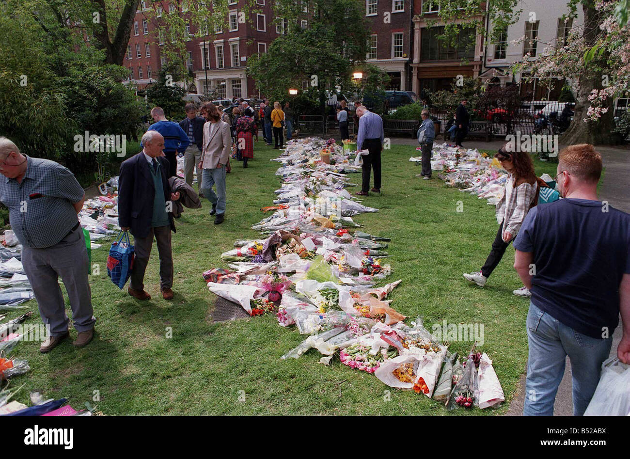Soho Admiral Duncan Pub Nail Bomb 1999 Soho bombing memorial tribute in Soho Square People walk through the park looking at the Stock Photo