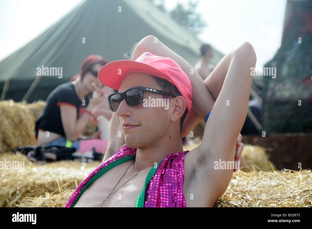 A young boy having rest at the Secret Garden Party, UK 2008 Stock Photo