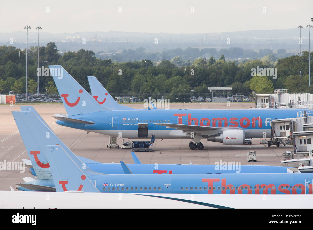 Thomson fleet of aircraft at gates at MAN airport, Manchester, England, United Kingdom Stock Photo