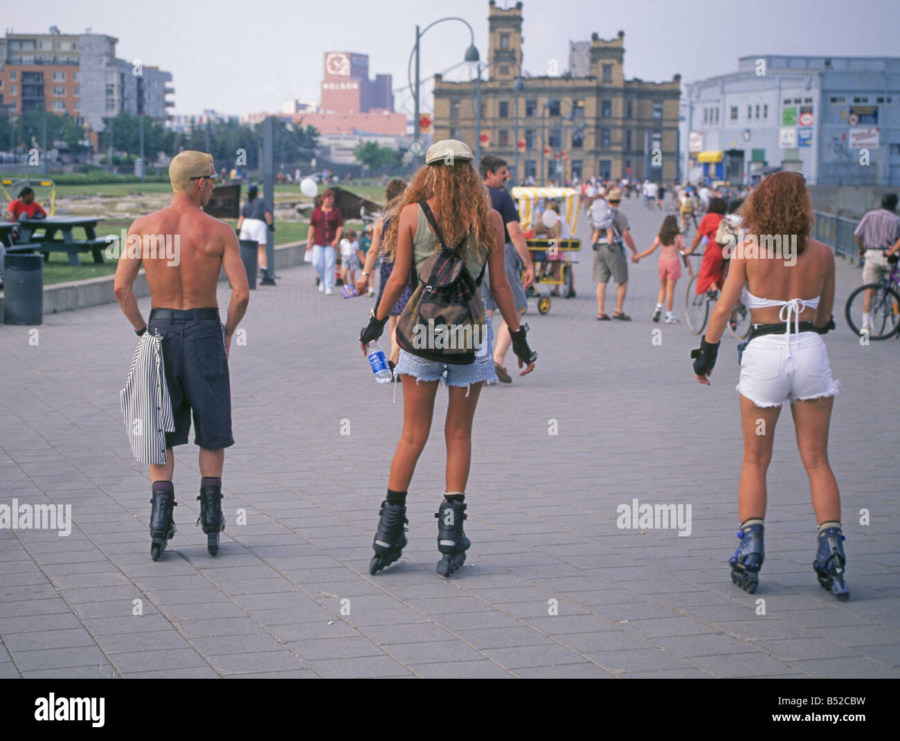 Teenage rollerbladers inline skaters cruise the sidewalk in Old Town or
