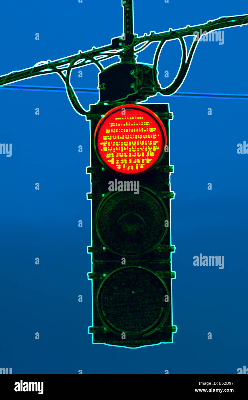 digitally altered red traffic stop light at night Stock Photo